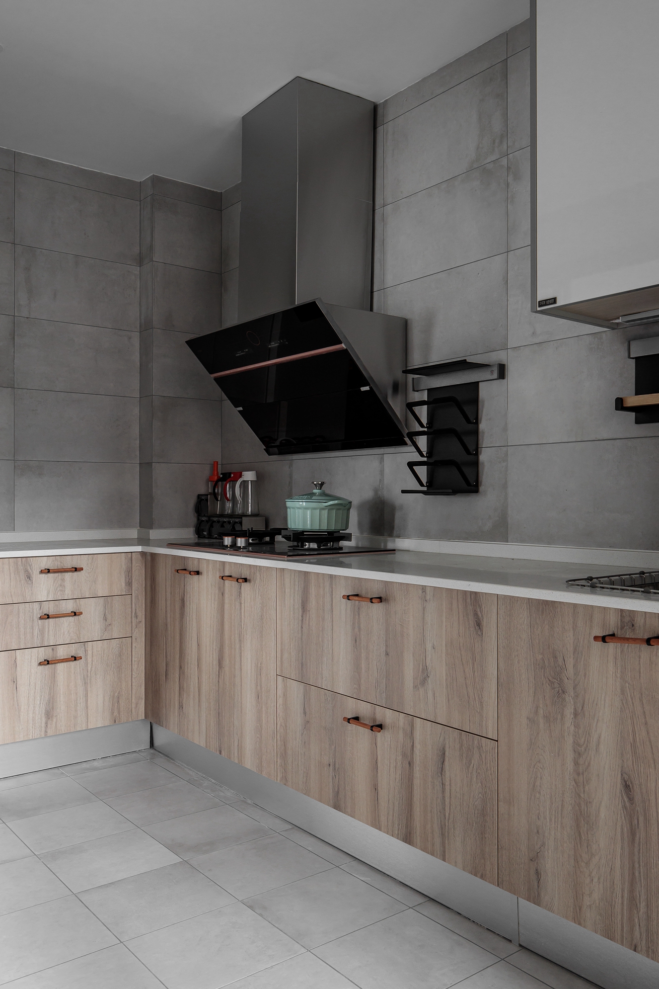 Kitchen with wood-look cabinetry and leather drawer pulls
